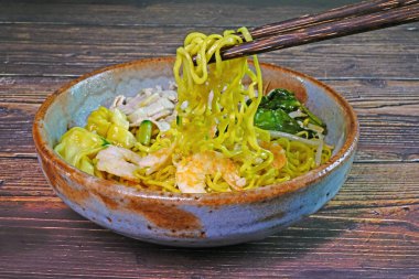 Fujian noodle, famous Phuket food. Chinese Noodles in vintage style ceramic bowl