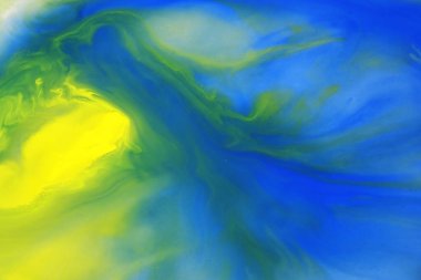 Colorful watercolor background (Movement of watercolor on liquid surface in ceramic plate, Photography) soft and blurred background