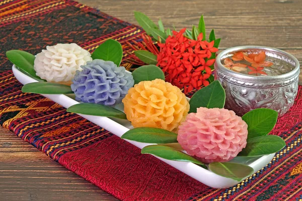 Thai dessert : Flower-shaped Thai sweetmeats (Khanom Chor Keaw) made from wheat flour, coconut milk and yolk. Beautiful Thai cuisine, Desserts for Mother\'s day.