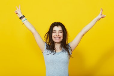 Happy lucky woman with hands raised clipart