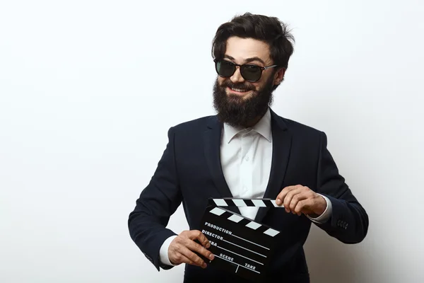 Movie director holding a clapperboard — Stock Photo, Image