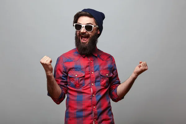 Happy hipster man with beard exults — Stock Photo, Image