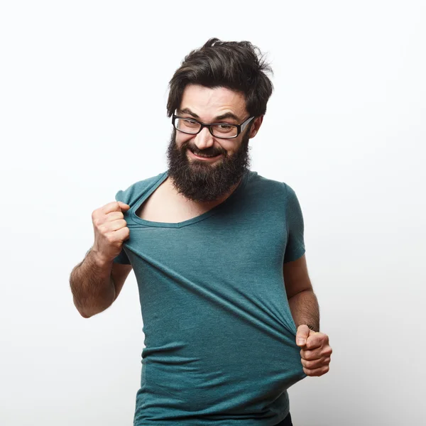 Angry man tearing the t-shirt — Stock Photo, Image