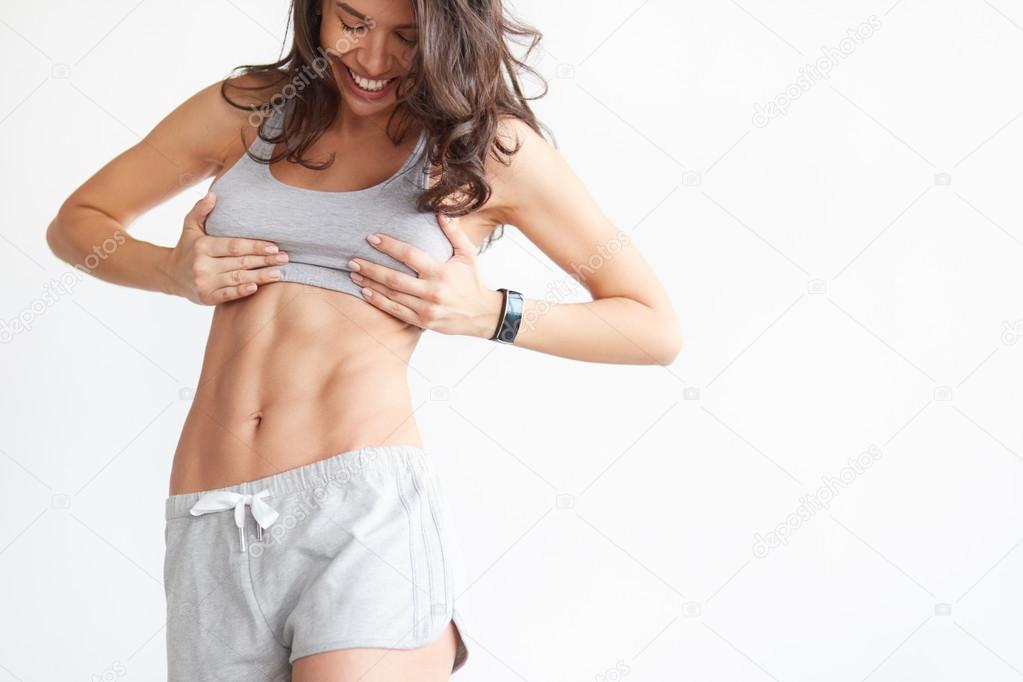 fit woman showing her abs