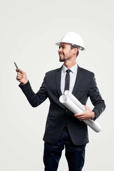 Happy male engineer pointing away — Stock Photo, Image