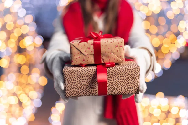 Anonymous woman with Christmas gift boxes — Stock Photo, Image