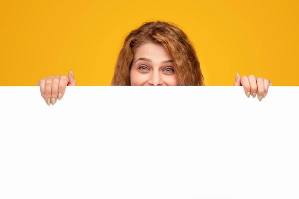 Cheerful woman showing empty banner — Stock Photo, Image