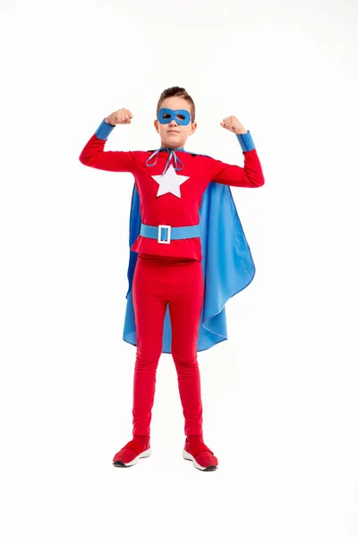 Strong little superhero showing muscles — Stock Photo, Image