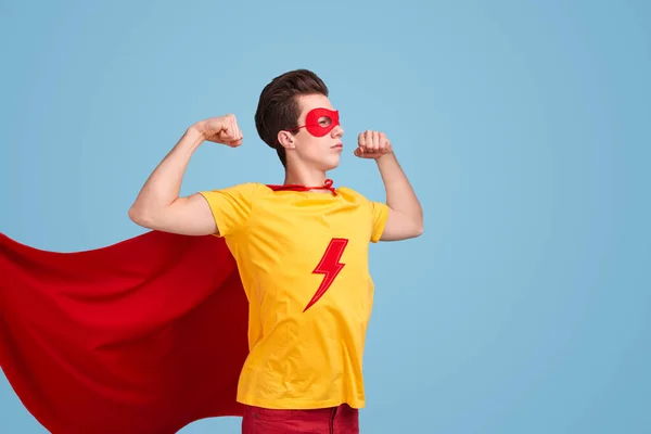 Strong superhero with fluttering cape — Stock Photo, Image