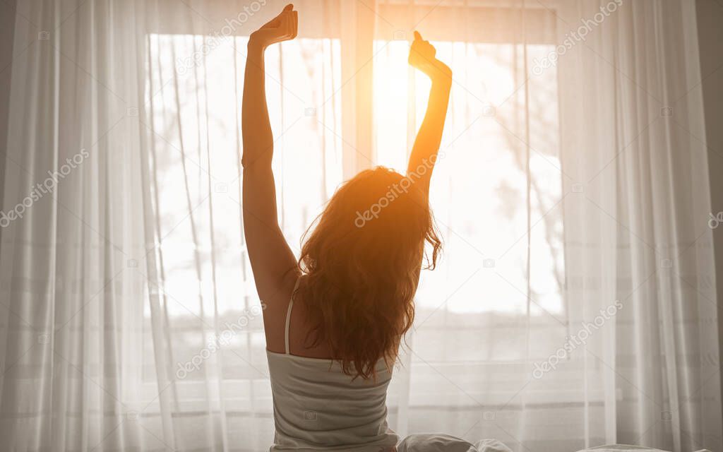Unrecognizable woman stretching body in morning