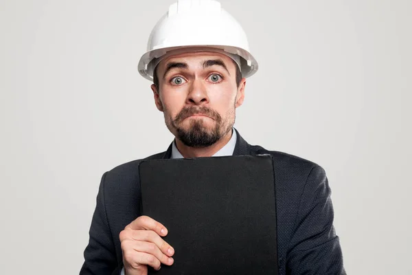Nervous male engineer with clipboard — Stock Photo, Image