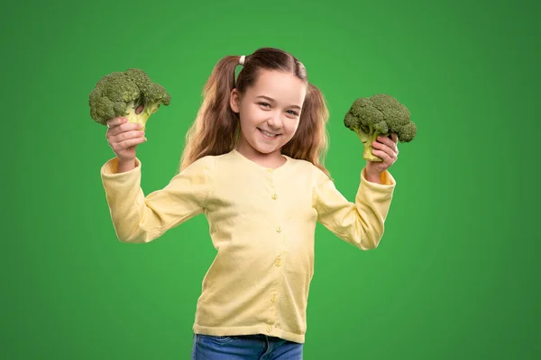 Cheerful kid with fresh broccoli — Stock Photo, Image