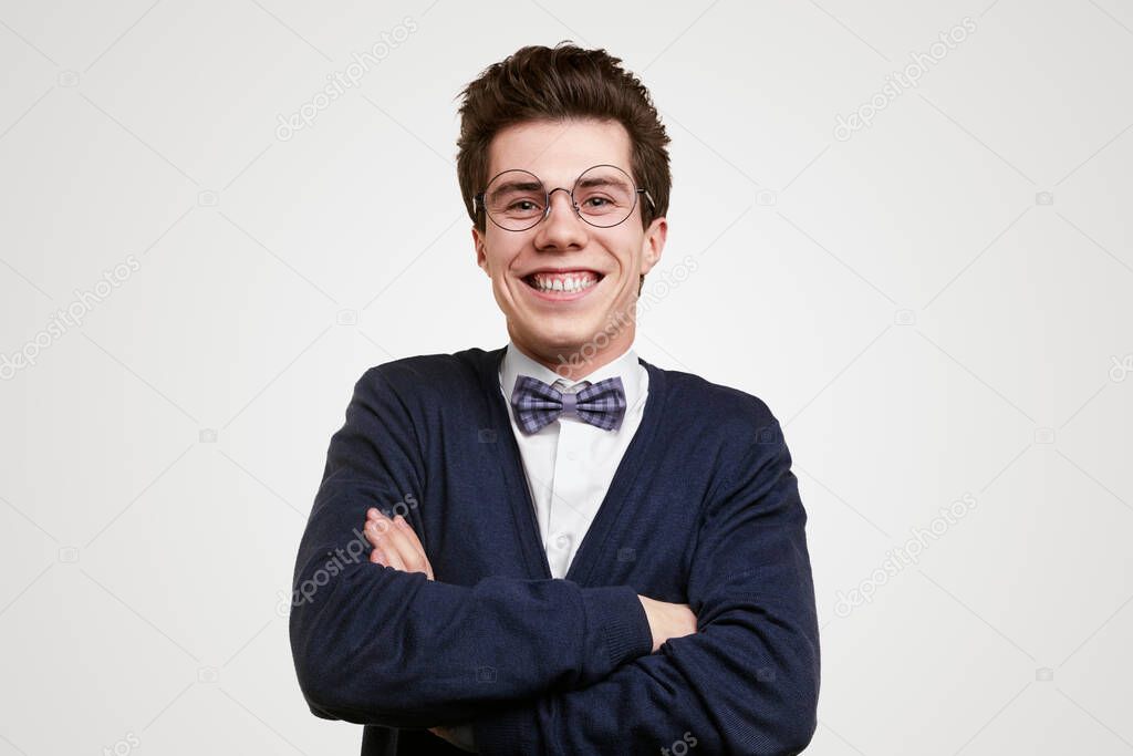 Laughing young man in nerdy outfit