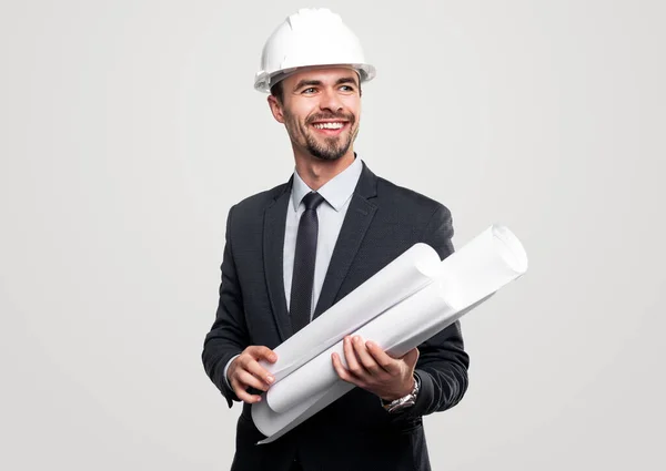 Confident architect in formal suit with blueprints — Stock Photo, Image