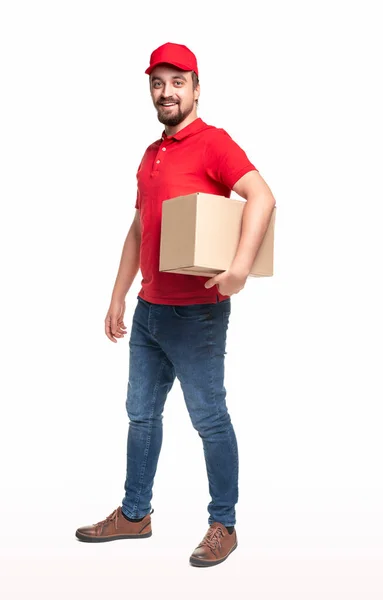 Cheerful delivery man with carton box — Stock Photo, Image