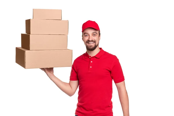 Sorrindo homem de entrega com caixas de papelão — Fotografia de Stock