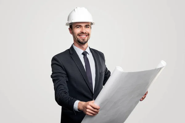 Male engineer reading draft and smiling — Stock Photo, Image