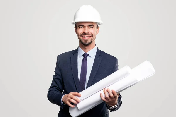 Friendly male contractor with blueprints — Stock Photo, Image