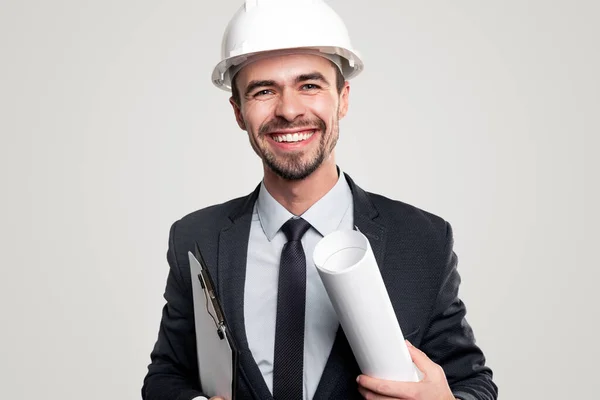 Cheerful architect with draft and clipboard — Stock Photo, Image