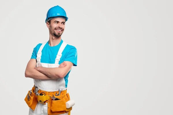 Confident repairman looking away with smile — Stock Photo, Image