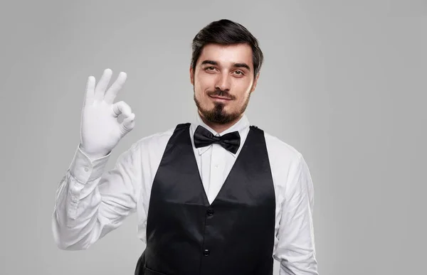 Confident waiter showing OK gesture — Stock Photo, Image