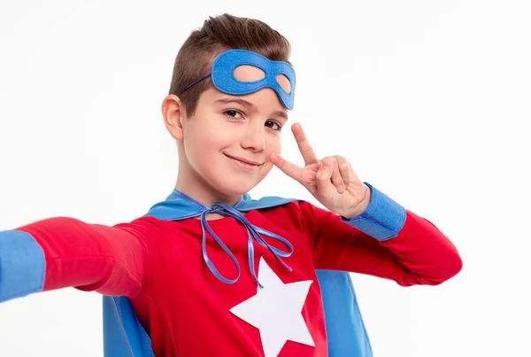 Superhero boy showing peace sign — Stock Photo, Image