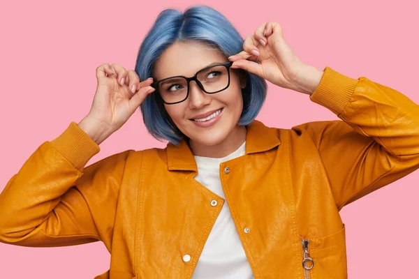 Stylish young woman adjusting eyeglasses — Stock Photo, Image