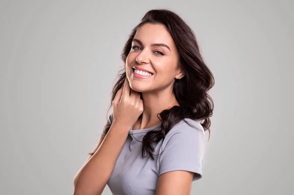 Happy adult woman touching cheek — Stock Photo, Image