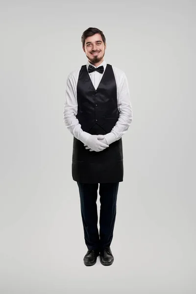 Friendly waiter in elegant uniform — Stock Photo, Image