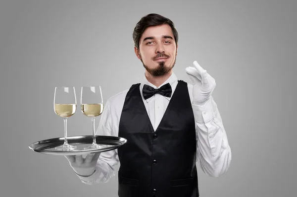 Waiter serving fine wine on tray — Stock Photo, Image