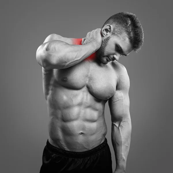 Muscular man suffering from neck pain. — Stock Photo, Image