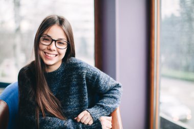 Portrait of pretty young woman wearing eyeglasses
