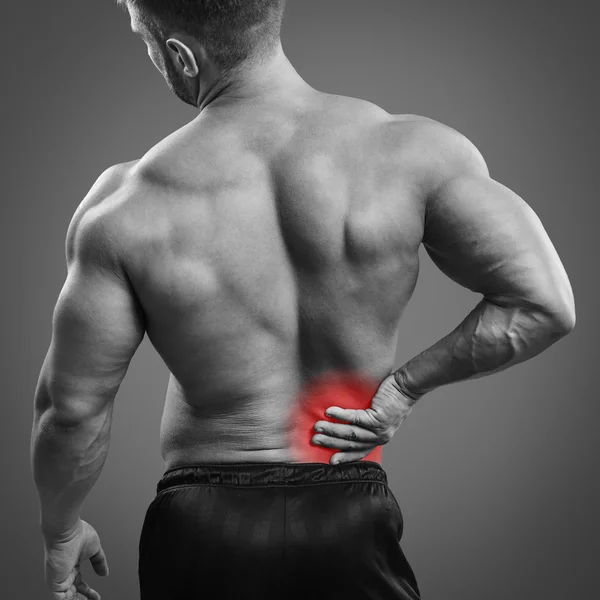 Muscular man Back pain — Stock Photo, Image