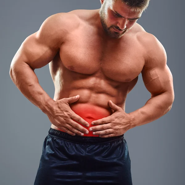 Ahtletic 筋肉マンの胃の痛み — ストック写真