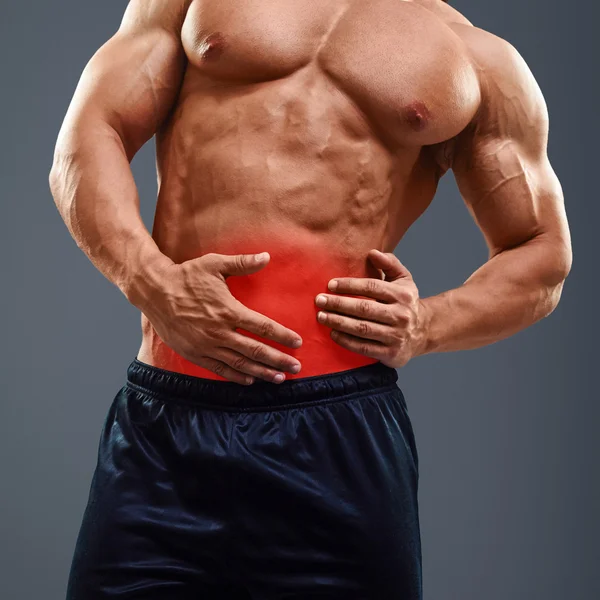 Ahtletic muscle man Pain in abdomen — Stock Photo, Image