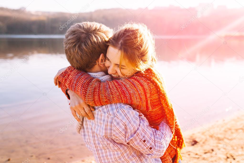 Couple in warm clothes hugging each other