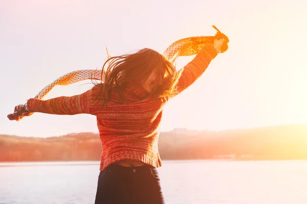 Silhouette of happy teen girl jumping — Stock Photo, Image