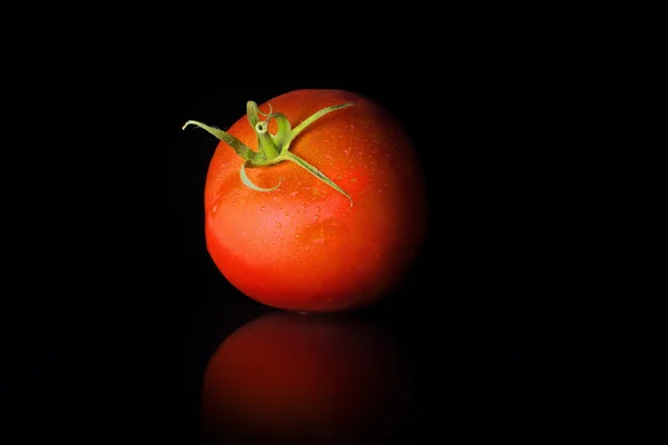 New tomatoes black background — Stock Photo, Image