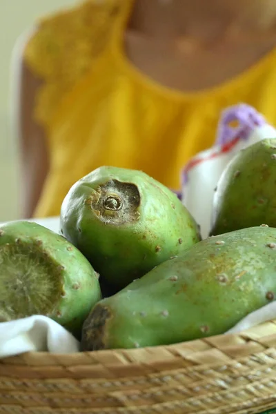 Young latin woman with tuna fruit