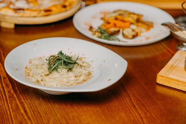 Macaroni and cheese with grated parmesan cheese on top