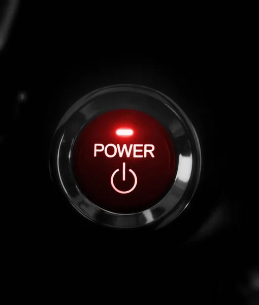 Close-up view of push button with red glowing light