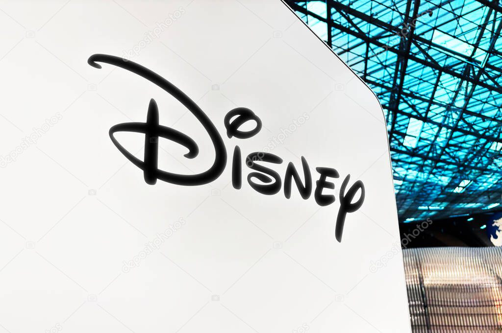 Disney huge logo close up from side view, illustrative editorial backdrop