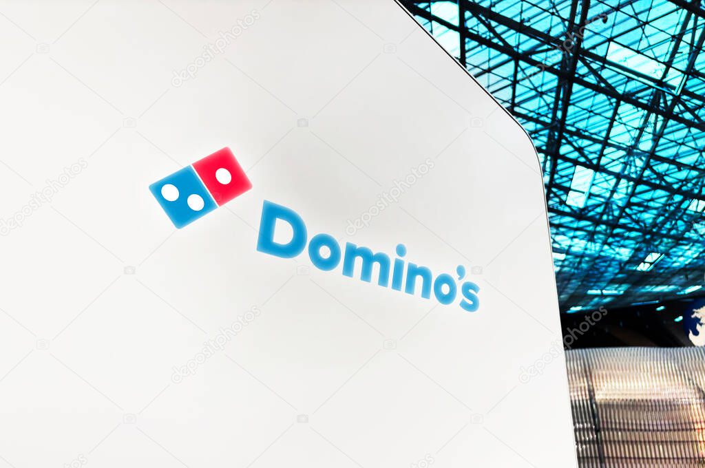 Dominos Pizza company outlet close up of logo, editorial backgroud. Food chain, fast food.