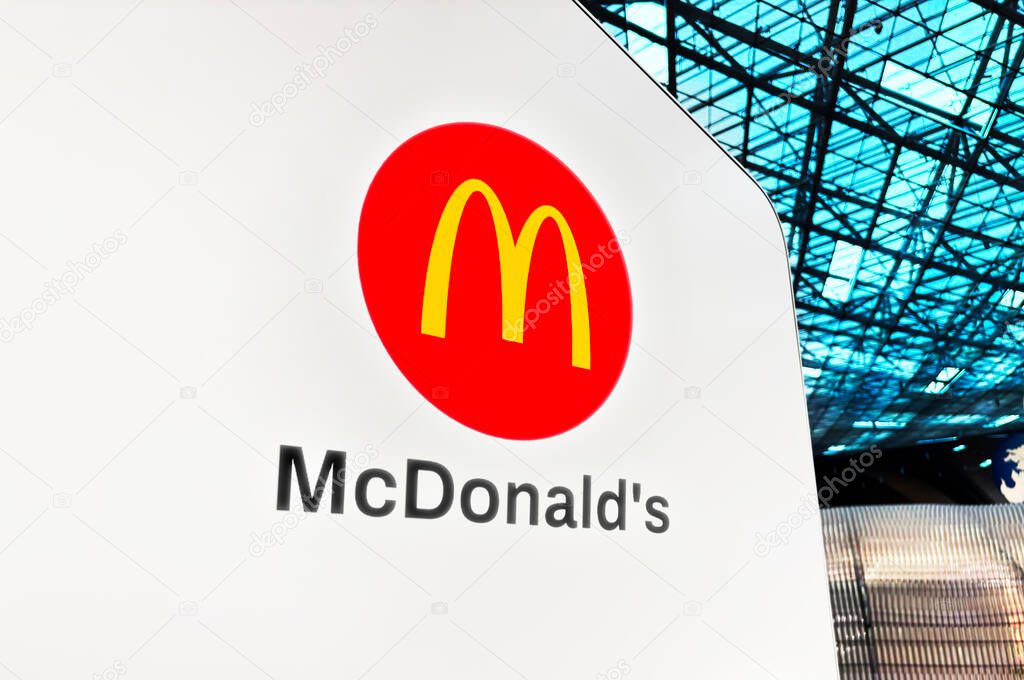 McDonalds branch and outlet concept on the airport, illustrative editorial. Fast food chain, burgers.