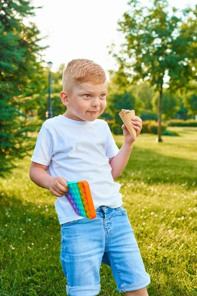 Cute Redhear Boy Holds Bubble Flexible Fidget Sensory Antistress Toy — Zdjęcie stockowe
