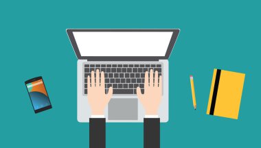 bir dizüstü bilgisayarda çalışan iş adamı