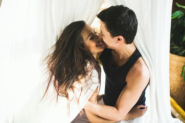 Happy couple in bed — Stock Photo, Image