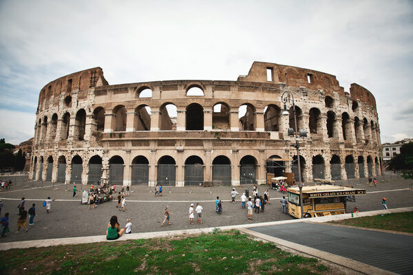 Colosseum in Rome with blue sky with clouds
