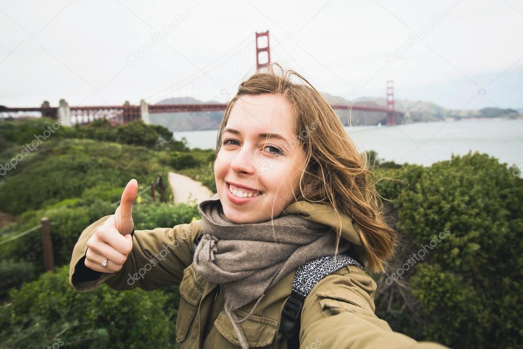 Beautiful teenage girl making selfie