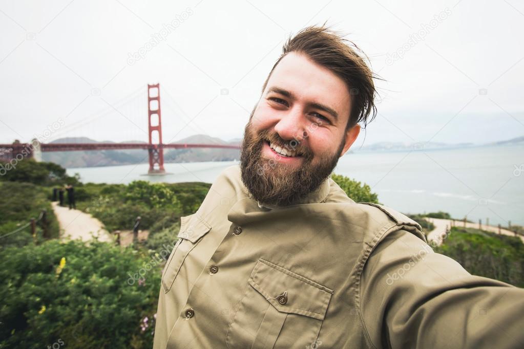 Handsome bearded man making selfie